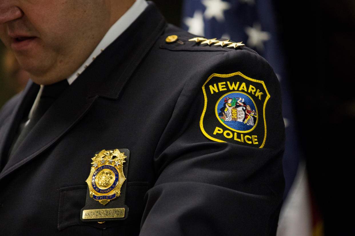 A close-cropped picture shows the badges and name plate of Newark Police Chief Anthony Campos.