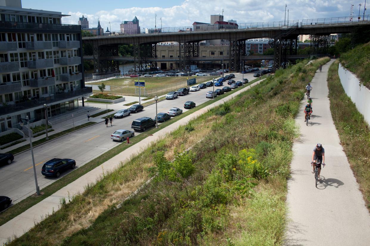 Cyclists ride on Milwaukee's Oak Leaf Trail north of the Holton St. bridge and Lakefront Brewery.