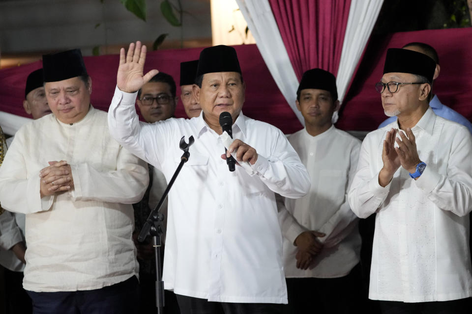 Indonesia's Defense Minister Prabowo Subianto, center, delivers a speech declaring his victory in Feb. 14 election as leaders of his coalition parties, Airlangga Hartarto of Golkar Party, left, Raja Juli Antoni of Indonesian Solidarity Party, second right, and Zulkifli Hasan of National Mandate Party, right, react, in Jakarta, Indonesia, Wednesday, March 20, 2024. Subianto was announced the winner of last month's presidential election Wednesday over two former governors who have vowed to contest the result in court over alleged irregularities. (AP Photo/Achmad Ibrahim)