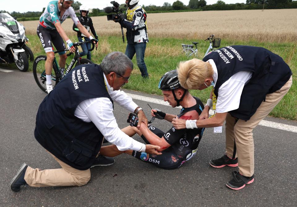 Team DSM team’s American rider Kevin Vermaerke receives medical treatment (AFP via Getty Images)