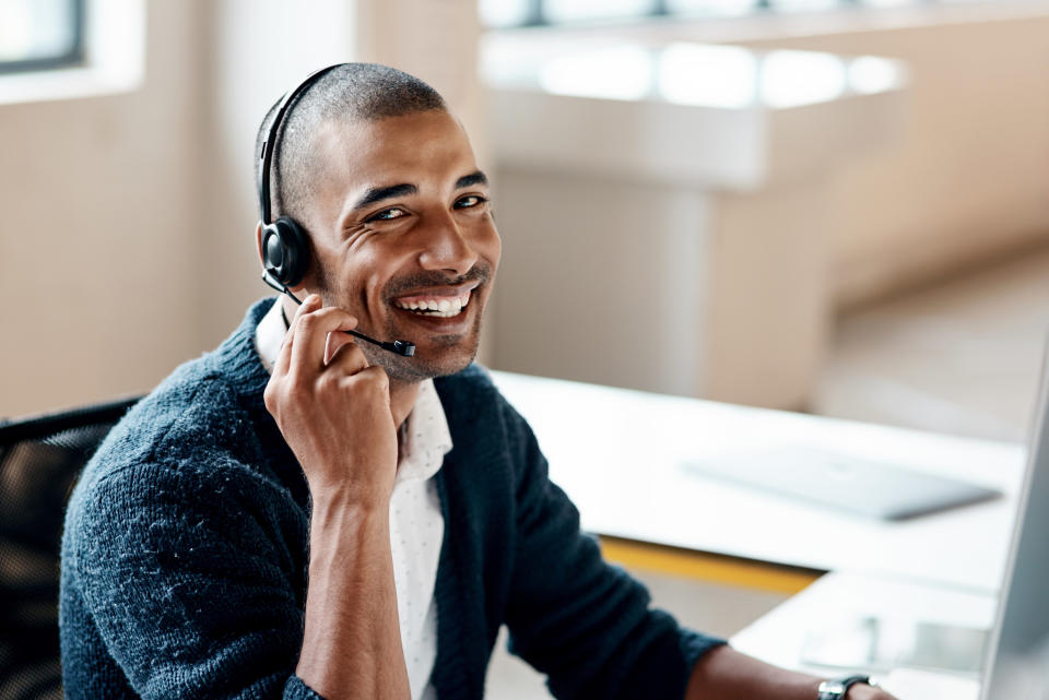 Man with headset on smiling