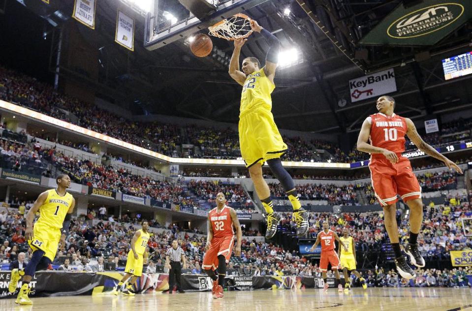 Michigan forward Jordan Morgan (52) dunks against Ohio State in the first half of an NCAA college basketball game in the semifinals of the Big Ten Conference tournament Saturday, March 15, 2014, in Indianapolis. (AP Photo/Michael Conroy)