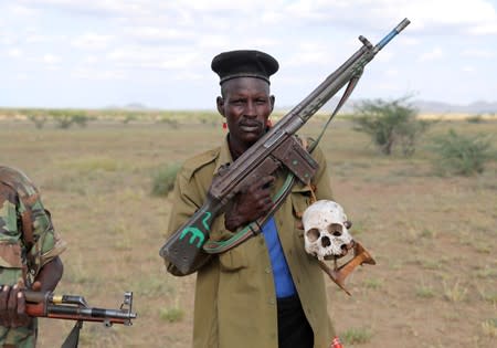The Wider Image: When raiders menace in northern Kenya, grab your guns