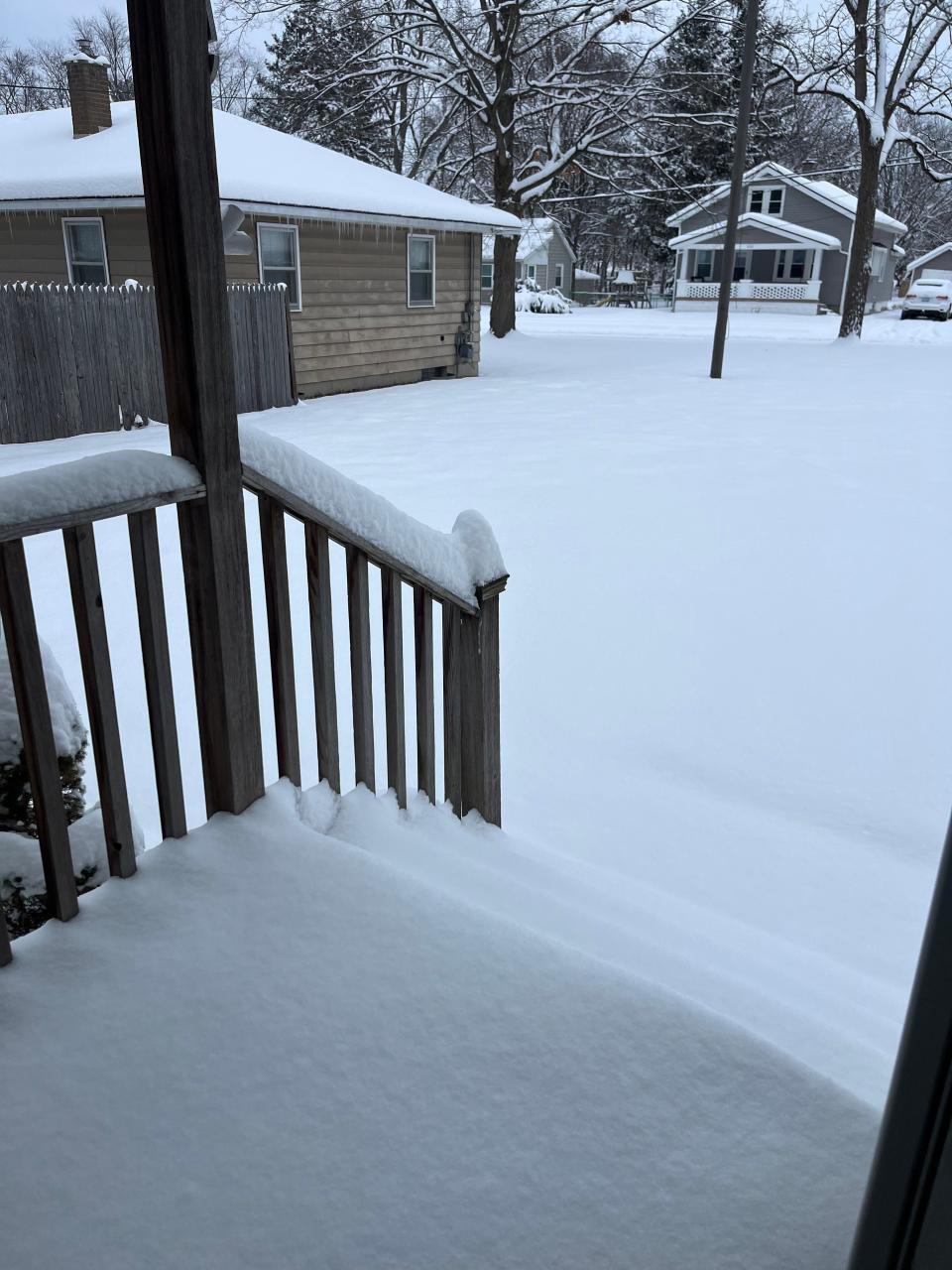 View of snowy yard from a home in Grand Rapids, Michigan.