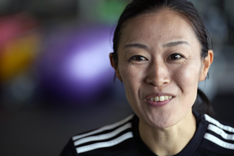 Yoshimi Yamashita of Japan, one of three women picked to be head referees at the men's soccer World Cup, speaks during an interview withe The Associated Press Monday, June 27, 2022, at JFA YUME Field in Chiba, near Tokyo. (AP Photo/Eugene Hoshiko)