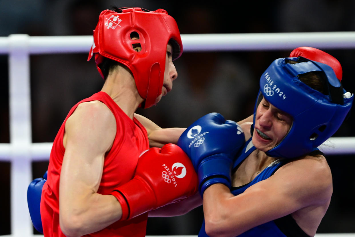 VILLEPINTE, FRANCE - AUGUST 04: Yu-Ting Ling (red) of Taiwan in action againstSvetlana Staneva (blue) of Bulgaria during the women's 57kg quarter-final boxing match on day nine of the Olympic Games Paris 2024 at the North Paris Arena in Villepinte, France on August 04, 2024. (Photo by Mehmet Murat Onel/Anadolu via Getty Images)