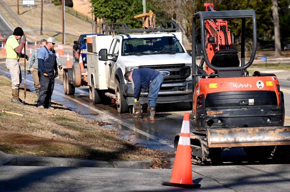A crew works on a water line break out front of Covenant Presbyterian Church on N. Columbia St. in Milledgeville Tuesday.