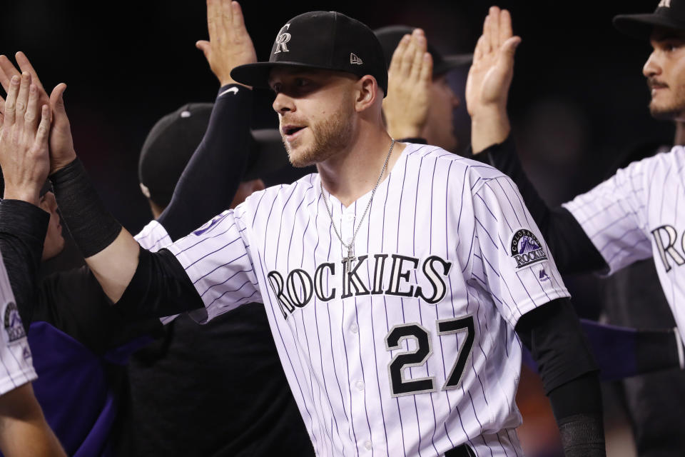Colorado Rockies shortstop Trevor Story is congratulated by teammates after the team's baseball game against the San Francisco Giants on Wednesday, Sept. 5, 2018, in Denver. Colorado won 5-3. (AP Photo/David Zalubowski)
