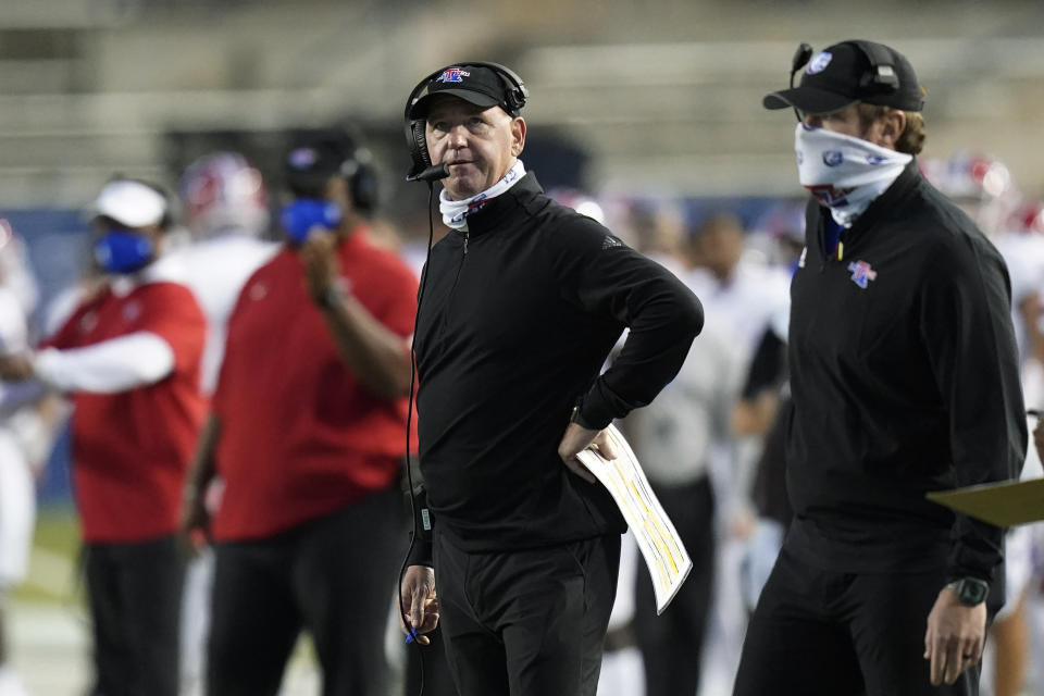 Louisiana Tech coach Skip Holtz looks at the scoreboard during the first half of the team's NCAA college football game against BYU on Friday, Oct. 2, 2020, in Provo, Utah. (AP Photo/Rick Bowmer, Pool)