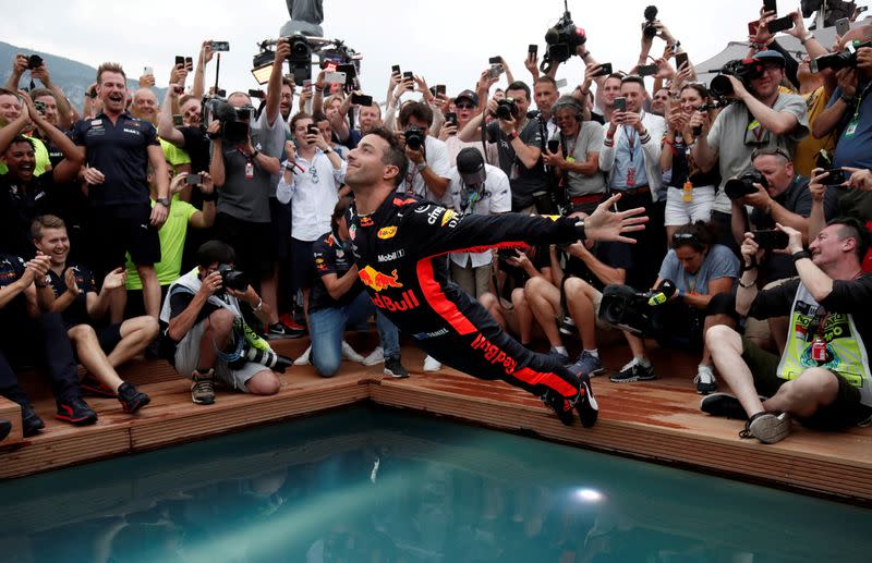 FILE PHOTO: Monaco Grand Prix winner Daniel Ricciardo of Red Bull Racing belly flops into a pool as he celebrates with his team