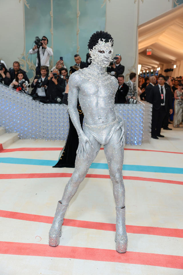 Lil Nas X appeared in silver body paint and platform boots. Photo: Getty