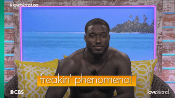 Love Island contestant smiling and saying freakin phenomenal