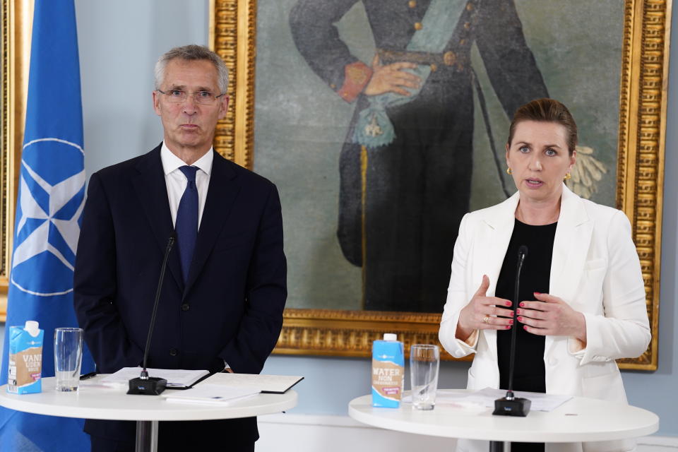 NATO Secretary General Jens Stoltenberg, left, and Danish Prime Minister Mette Frederiksen meet at Kastellet in Copenhagen, Denmark, Thursday May 19, 2022. (Martin Sylvest/Ritzau Scanpix via AP)