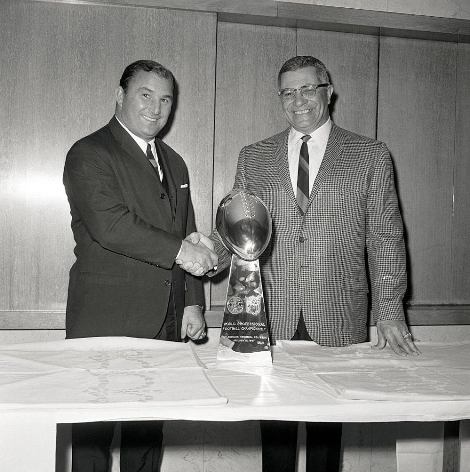 coach vince lombardi shaking hands with hank stram