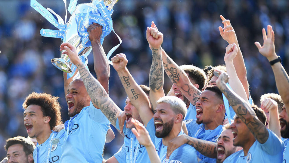 Manchester City captain Vincent Kompany lifts the Premier League Trophy after the Premier League match between Brighton & Hove Albion and Manchester City at American Express Community Stadium. (Photo by Shaun Botterill/Getty Images)