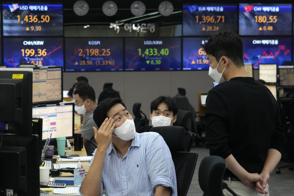 Currency traders work at the foreign exchange dealing room of the KEB Hana Bank headquarters in Seoul, South Korea, Thursday, Sept. 29, 2022. Asian stock markets have followed Wall Street higher after Britain’s central bank moved forcefully to stop a budding financial crisis. (AP Photo/Ahn Young-joon)