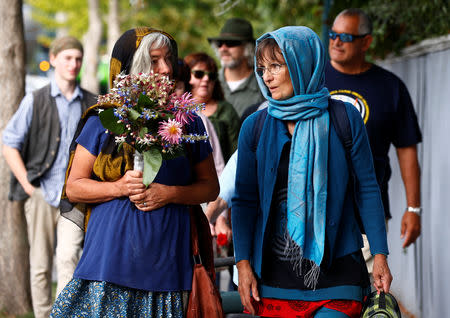 People attend a vigil for victims of the mosque shootings in Christchurch, New Zealand March 24, 2019. REUTERS/Edgar Su