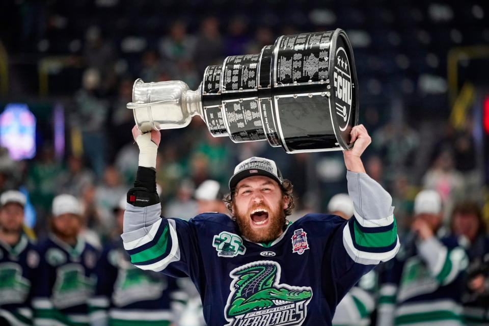 Florida Everblades forward Logan Lambdin (17) celebrates with the Kelly Cup at Hertz Arena in Estero on Friday, June 9, 2023. The team won 4-3 against the Idaho Steelheads to sweep the series.