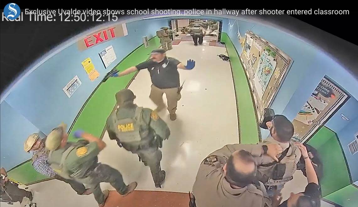 In this photo from surveillance video provided by the Uvalde Consolidated Independent School District via the Austin American-Statesman, authorities respond to the shooting at Robb Elementary School in Uvalde, Texas, on May 24, 2022.