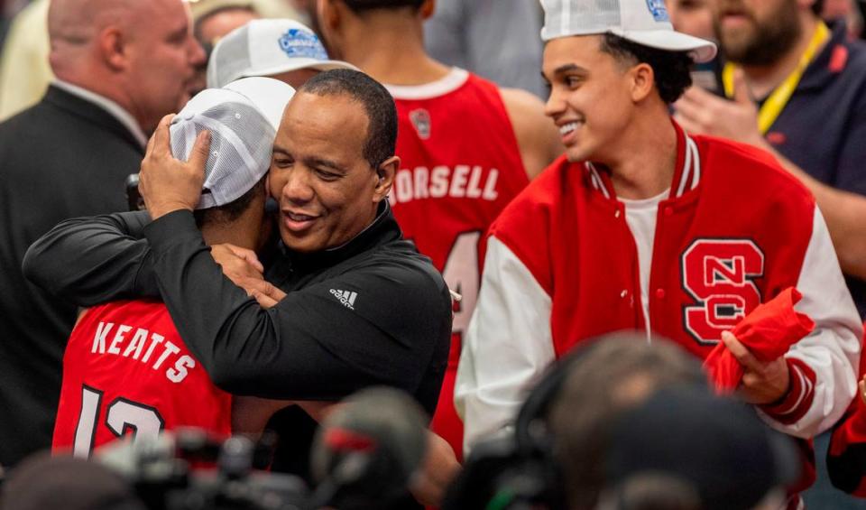 N.C. State coach Kevin Keatts embraces his son K.J. Keatts (13) as they celebrate the Wolfpack’s ACC Tournament Championship following their 84-76 victory over North Carolina at Capitol One Arena on Saturday, March 16, 2024 in Washington, D.C. Robert Willett/rwillett@newsobserver.com