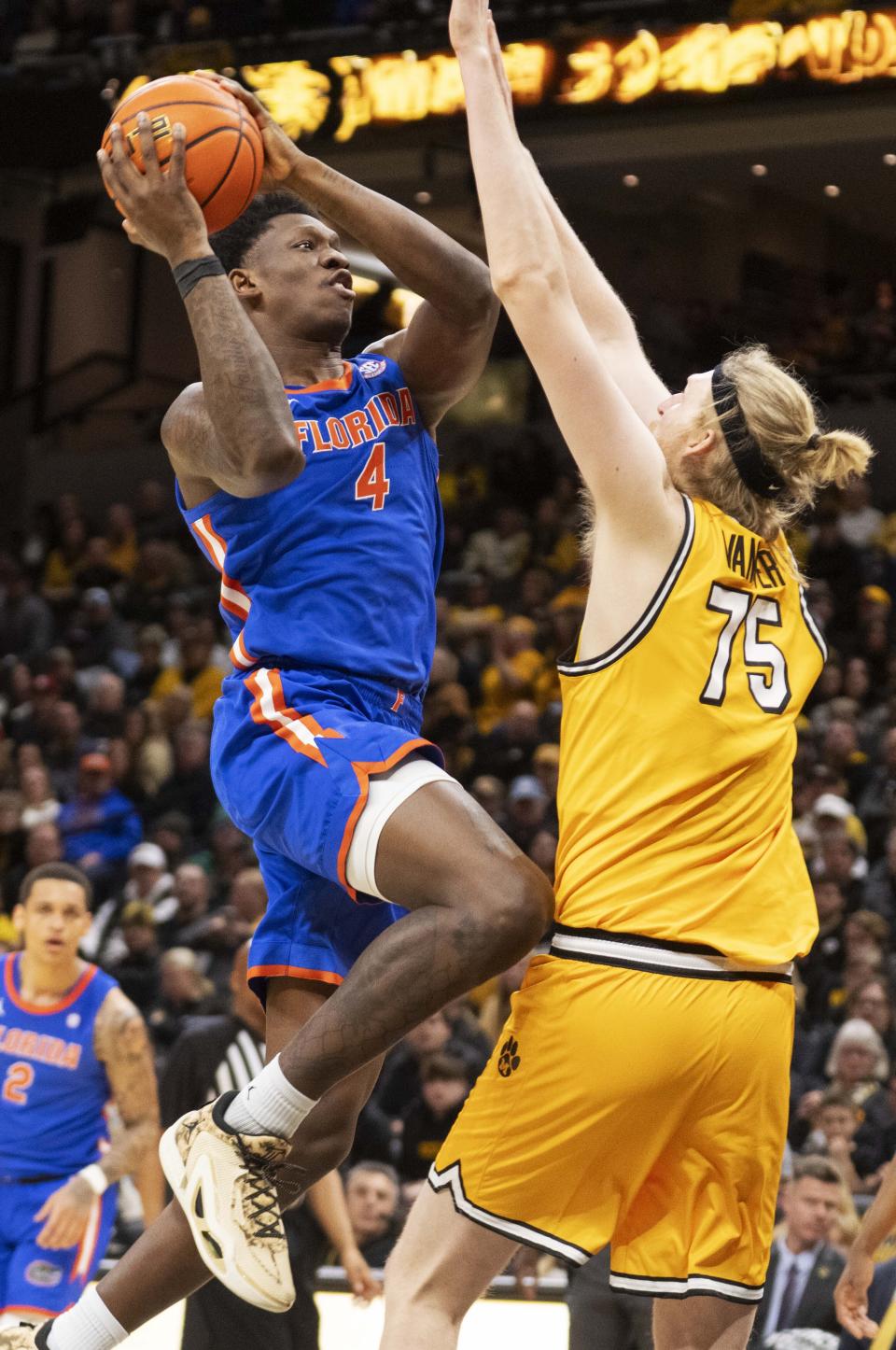 Florida's Tyrese Samuel, left, shoots over Missouri's Connor Vanover during the first half of an NCAA college basketball game Saturday, Jan. 20, 2024, in Columbia, Mo. (AP Photo/L.G. Patterson)