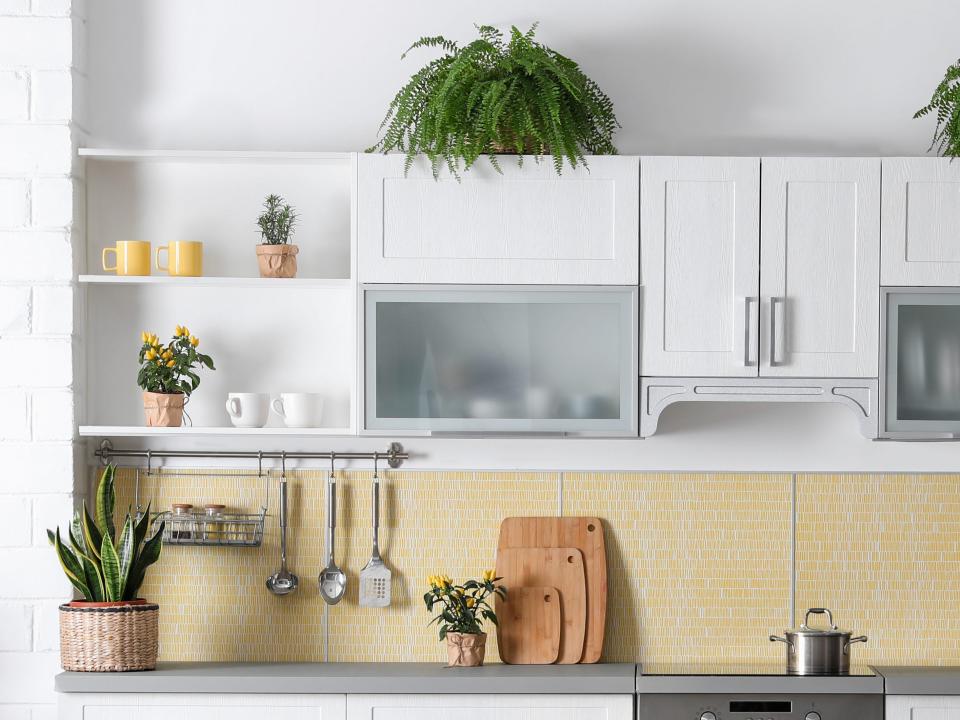 Mostly white and cream kitchen with plants