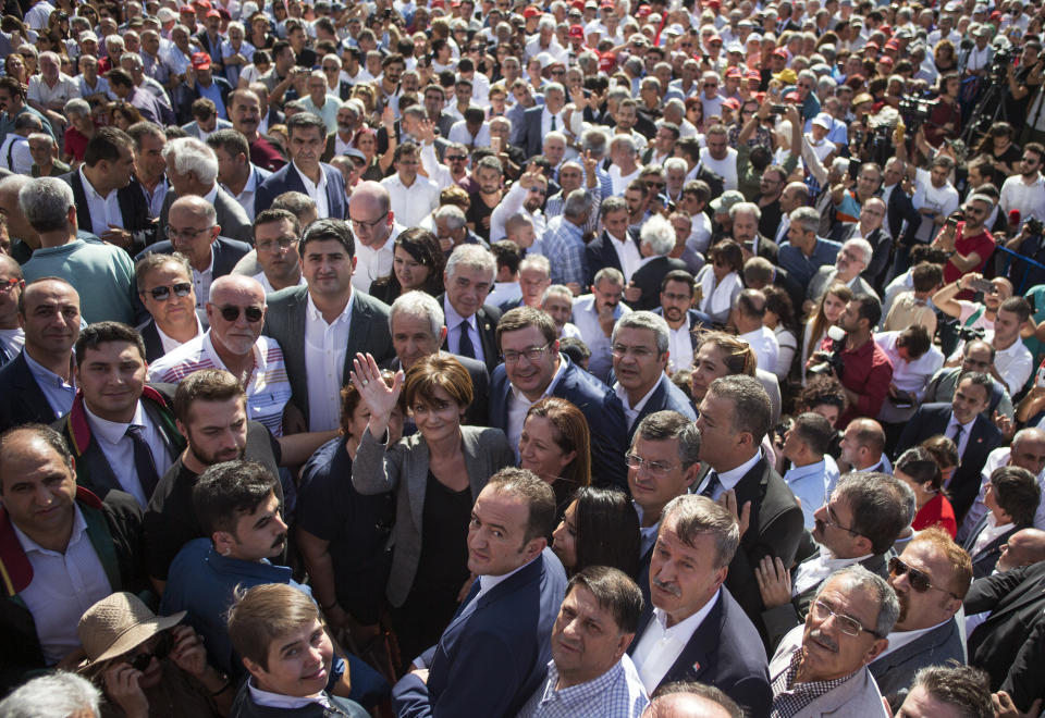 Canan Kaftancioglu, the head of Turkey's secular Republican People's Party in Istanbul, gestures after her trial in Istanbul, Friday, Sept. 6, 2019. Turkey's state-run news agency says a court has sentenced the leader of the Istanbul branch of Turkey's main opposition party to nearly 10 years in prison over a series of tweets.(AP Photo)