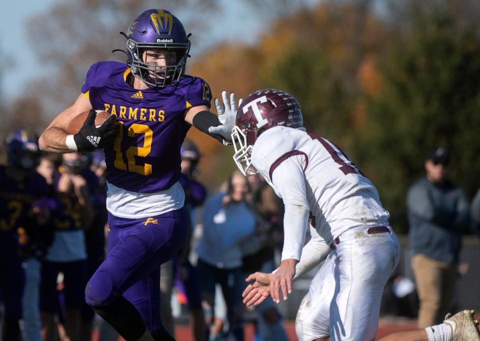 Farmington's Ethan Evans runs the ball during the class 2A second round playoff game at Farmington High on Saturday, Nov. 6, 2021. The Farmers beat the Turks 35-12.