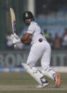 India's Shreyas Iyer flicks the ball towards leg during the day four of their first test cricket match with New Zealand in Kanpur, India, Sunday, Nov. 28, 2021. (AP Photo/Altaf Qadri)