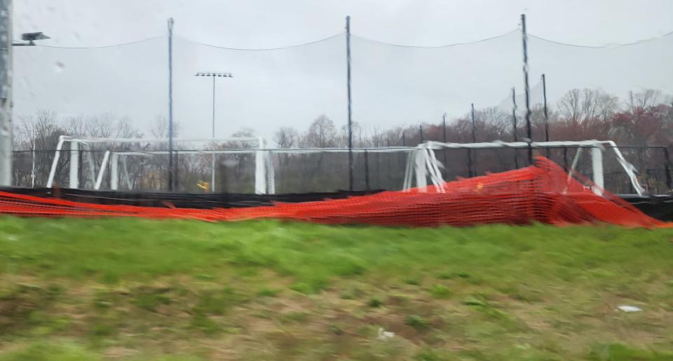 Netless soccer goal posts sit on the new turf field on Marne Highway