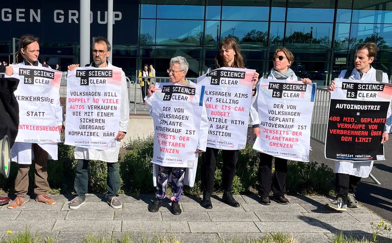 Activists protest before the annual general Volkswagen meeting in Berlin