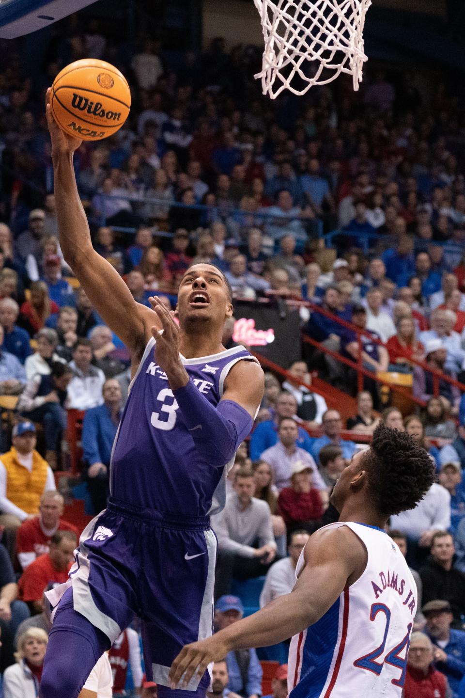 Kansas State forward David N'Guessan (3) shoots a layup against Kansas during last year's Sunflower Showdown game against Kansas at Allen Fieldhouse in Lawrence.