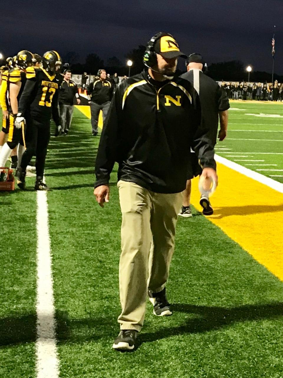 Northmor football coach Scott Armrose walks the sidelines during a game with Highland last season. The Golden Knights are making their sixth playoff appearance in a row when they go to Bellaire Saturday at 1:30 p.m.