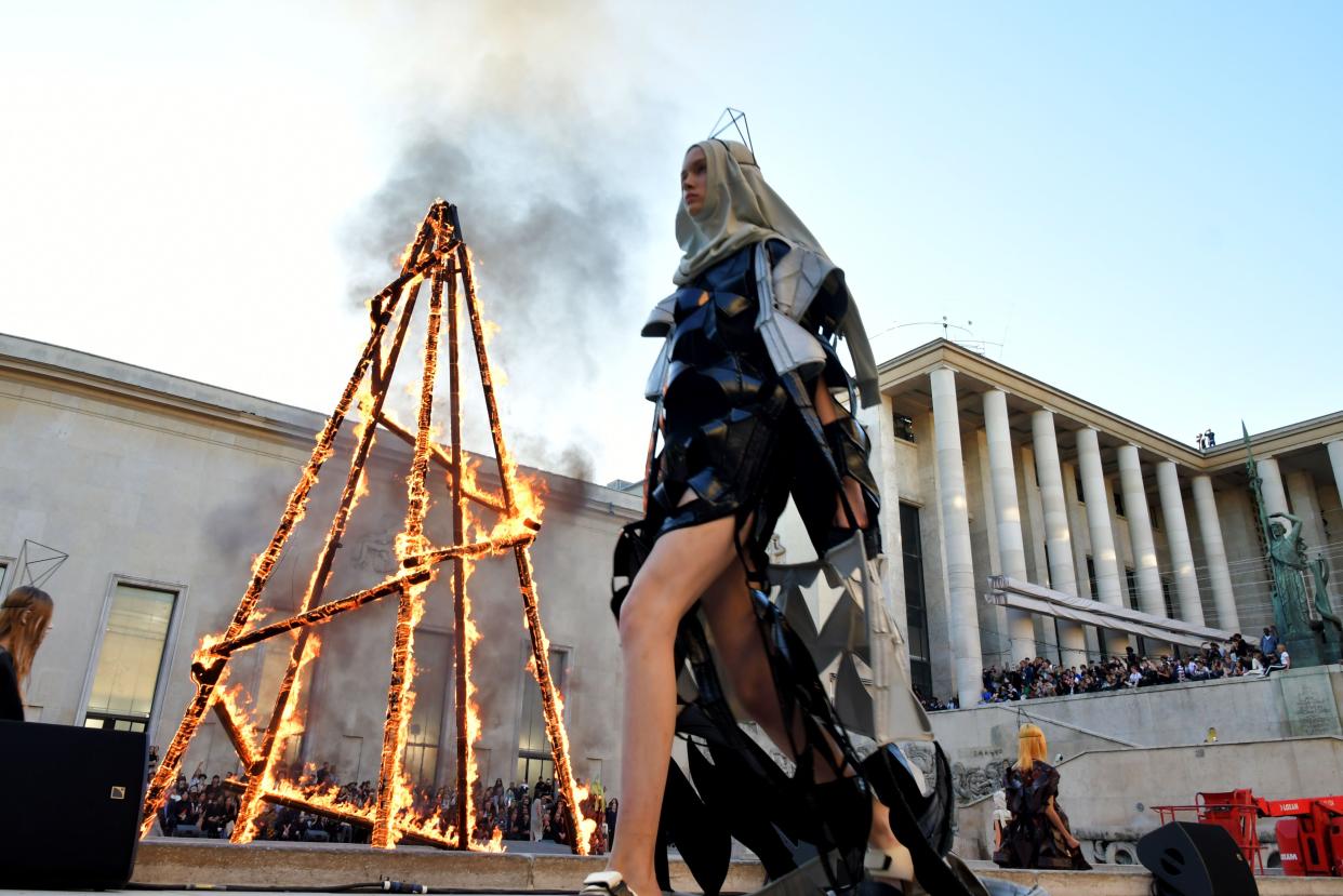 A burning pyre set the stage for Rick Owens’ PFW show. [Photo: Rex]