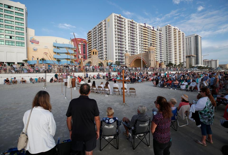 A crowd gathers for sunrise service on the sand just east of the Daytona Beach Bandshell. The weather forecast looks promising for a sunny morning for this year's service.