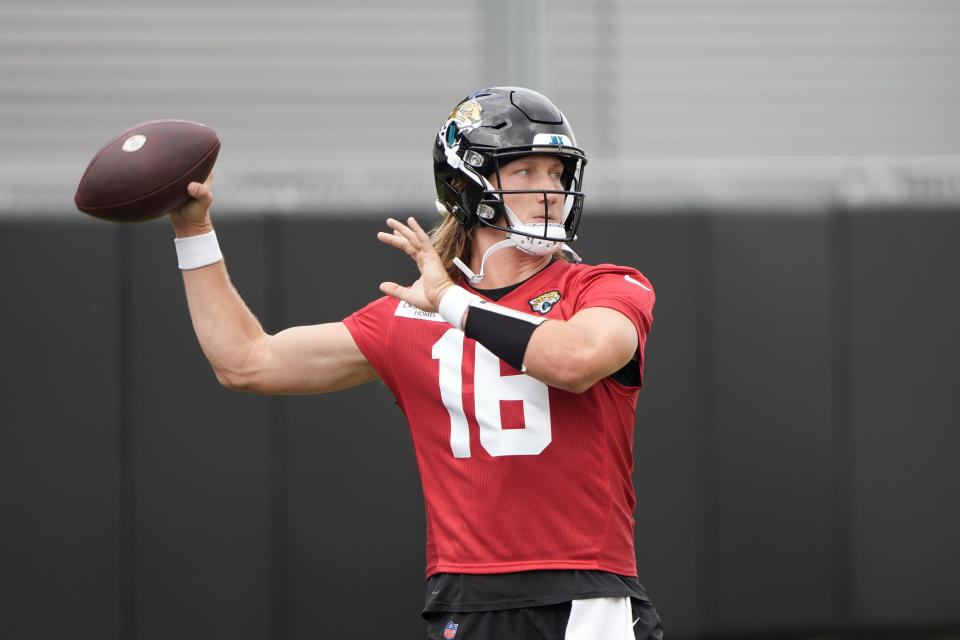 Jacksonville Jaguars quarterback Trevor Lawrence (16) passes the ball during the team's NFL football practice, Monday, May 20, 2024, in Jacksonville, Fla. (AP Photo/John Raoux)