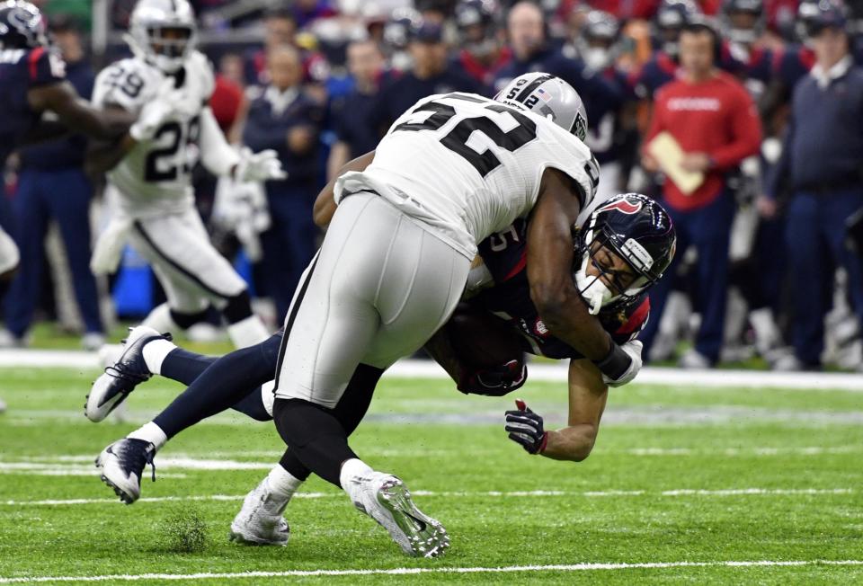 <p>Houston Texans wide receiver Will Fuller (15) is tackled by Oakland Raiders defensive end Khalil Mack (52) during the first half of the AFC Wild Card playoff football game at NRG Stadium. Mandatory Credit: Jerome Miron-USA TODAY Sports </p>