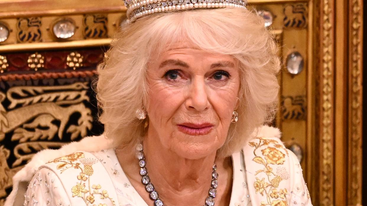  Queen Camilla paired coronation dress with stunning tiara. Seen here wearing both to the State Opening of Parliament. 