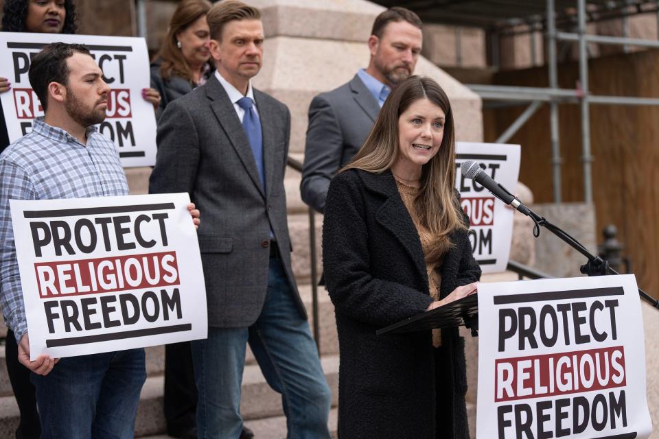 Deborah Reeves, a pastor at First Baptist Church of Austin, expresses her disapproval for school chaplain programs as religious groups and politicians meet on the west steps of the Texas Capitol for a Feb. 29 news conference.