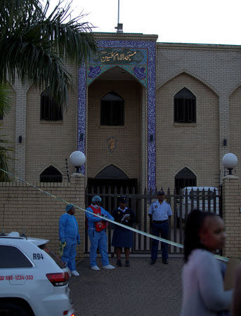 Police investigators collect evidence at a mosque where three men where attacked in Ottawa, South Africa, May 10, 2018. REUTERS/Rogan Ward