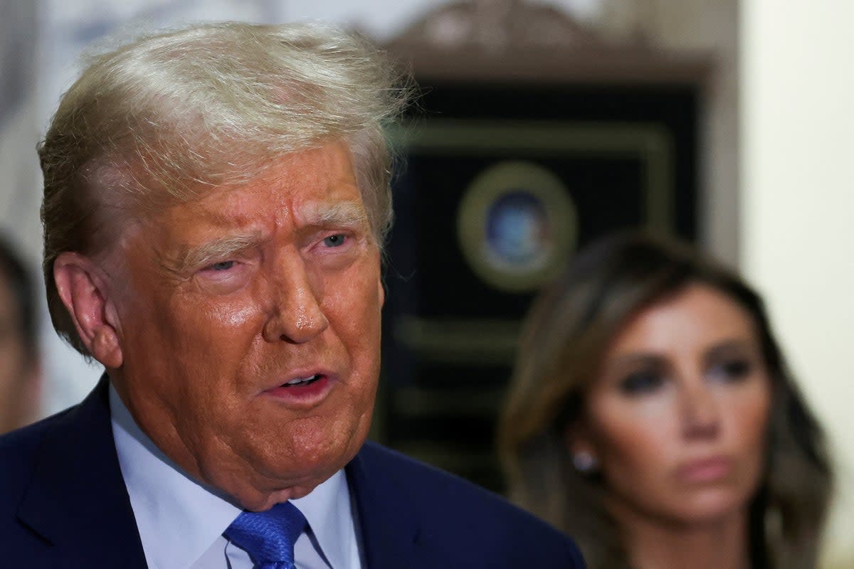 Donald Trump, next to his attorney Alina Habba, leaves the courtroom after attending his civil fraud trial on 6 November, 2023. (REUTERS)