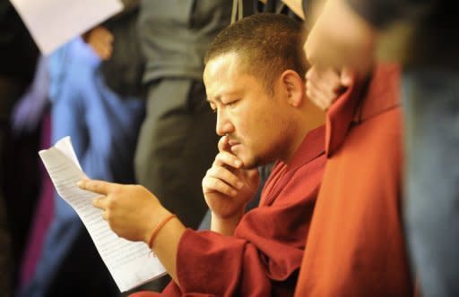 A Tibetan monk in exile reads a statement of Tibetan in exile prime minister Lobsang Sangay during a ritual marking the 53rd anniversary of the 1959 Tibetan uprising against Chinese rule, at Boudhanath in Kathmandu. Tibet's government-in-exile has blamed China for a string of Tibetan self-immolations as it marked the anniversary of the Dalai Lama's failed revolt against Chinese rule