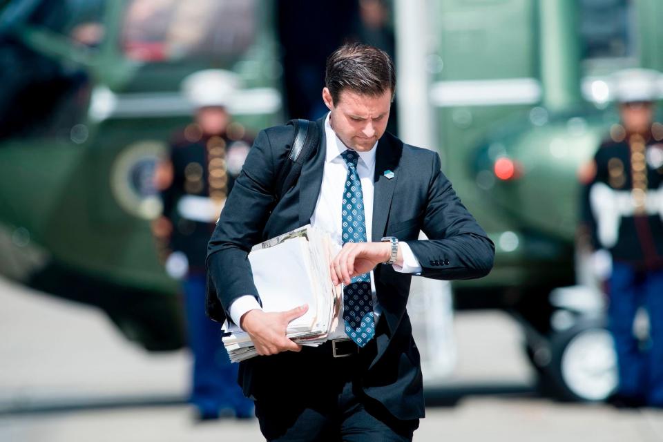 John McEntee, special assistant and personal aide follows US President Donald Trump to Air Force One at Andrews Air Force Base September 27, 2017 in Maryland.