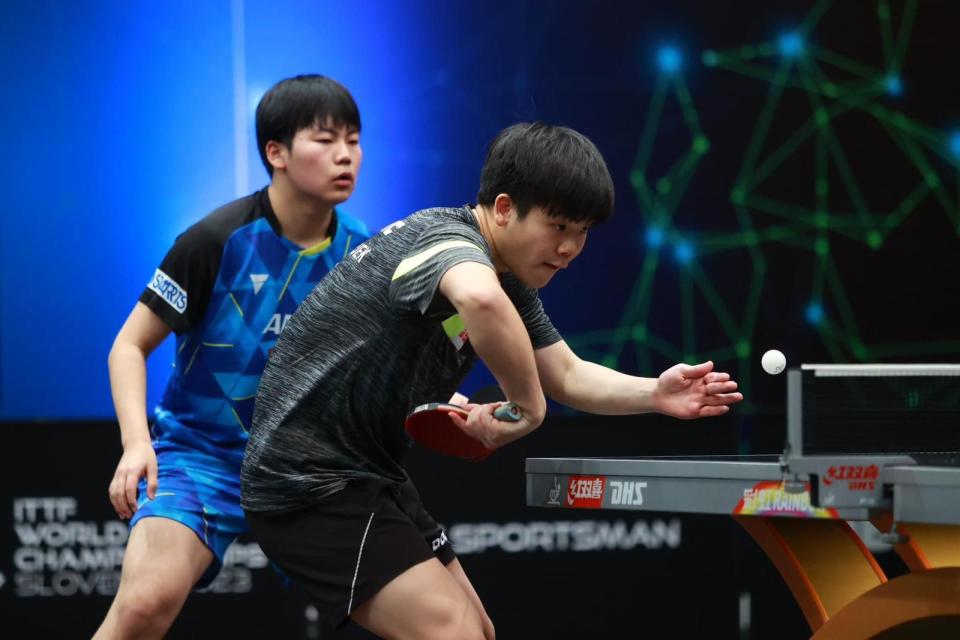 Singapore paddler Izaac Quek (front) with his men's doubles partner Sora Matsushima of Japan at the ITTF World Youth Championships 2023. (PHOTO: STTA)