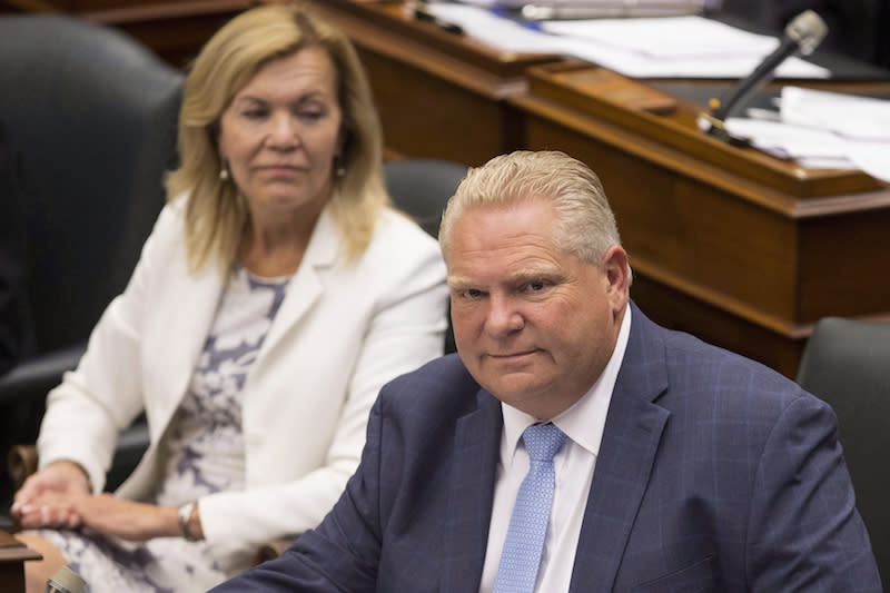 Ontario Premier Doug Ford, right, sits next to PC MPP Christine Elliott at Queen’s Park in Toronto on July 31, 2018. The PCs say they are repealing the modernized sexual-education curriculum and using a 1998 version instead. Photo from The Canadian Press.