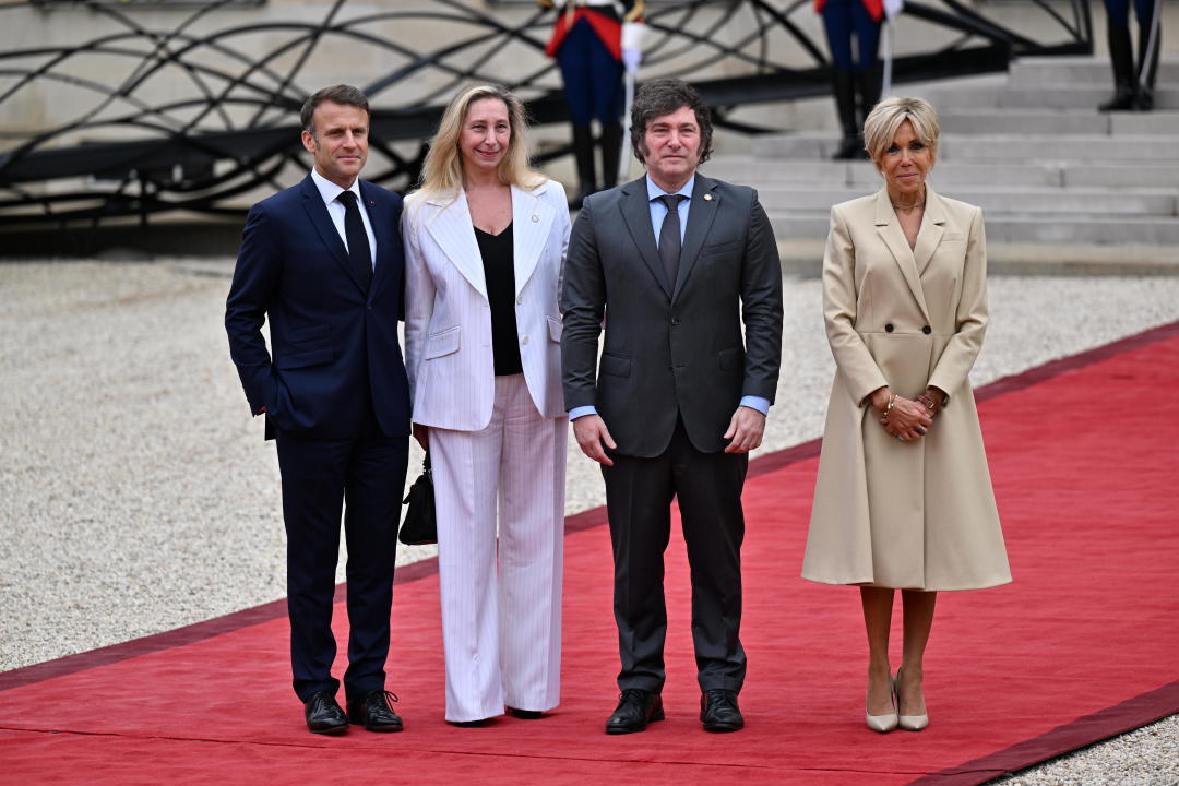 PARIS, FRANCE - JULY 26: France's President Emmanuel Macron (L) and his wife Brigitte Macron (R) greet Argentine's President Javier Milei (2nd R) and his sister Karina Milei General Secretary of the Presidency (2nd L) on arrival ahead of a reception for heads of state and governments ahead of the opening ceremony of the Paris 2024 Olympic Games, at the Elysee presidential palace in Paris, on July 26, 2024. (Photo by Mustafa Yalcin/Anadolu via Getty Images)