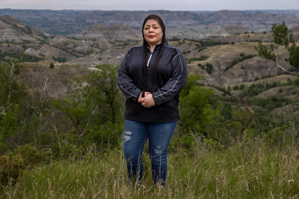 MHA Drug Enforcement special agent Dawn White stands in front of one of her favorite parts of North Dakota, the Badlands area south of the Fort Berthold Reservation. White is an Army veteran who grew up on the reservation and worked as a sergeant for the Tribal Police before joining the specialized drug task force based in Parshall, N.D.