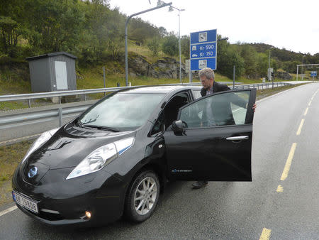 Arne Nordboe gets into his Nissan Leaf electric car in Finnoey, Norway September 8, 2017. REUTERS/Alister Doyle