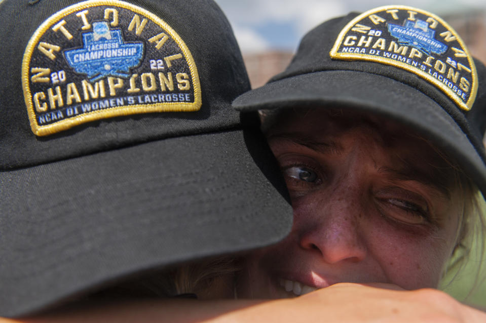 North Carolina attack Ally Mastroianni, right, cries while hugging a teammate while celebrating after winning during the NCAA college Division 1 women's lacrosse championship against Boston College in Baltimore, Sunday, May 29, 2022. (Vincent Alban/The Baltimore Sun via AP)