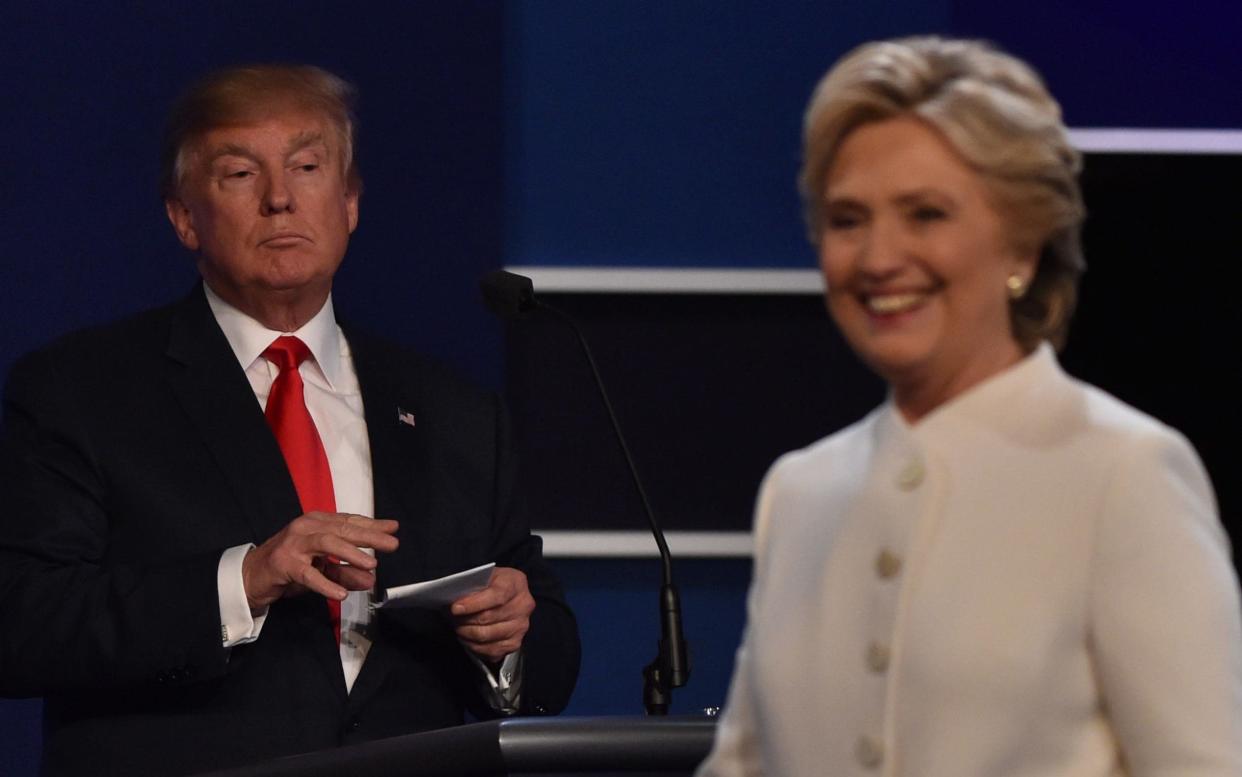 Donald Trump and Hillary Clinton at the final presidential debate in October 2016. - AFP